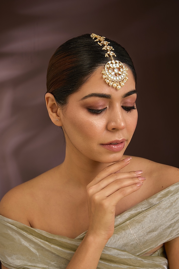 Gold Finish Kundan Polki & Pearl Crescent-Shaped Maangtikka In Sterling Silver by Kiara Luxe at Pernia's Pop Up Shop