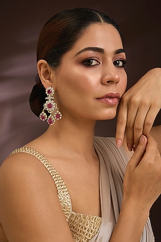 Gold Finish Kundan Polki & Ruby Gemstone Chandelier Earrings In Sterling Silver by Kiara Luxe