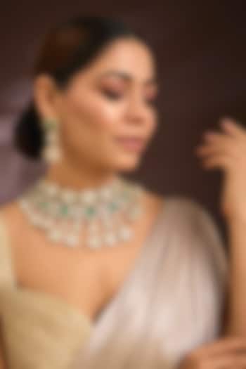 Gold Finish Moissanite Polki & Emerald Green Gemstone Choker Necklace Set In Sterling Silver by Kiara Luxe at Pernia's Pop Up Shop