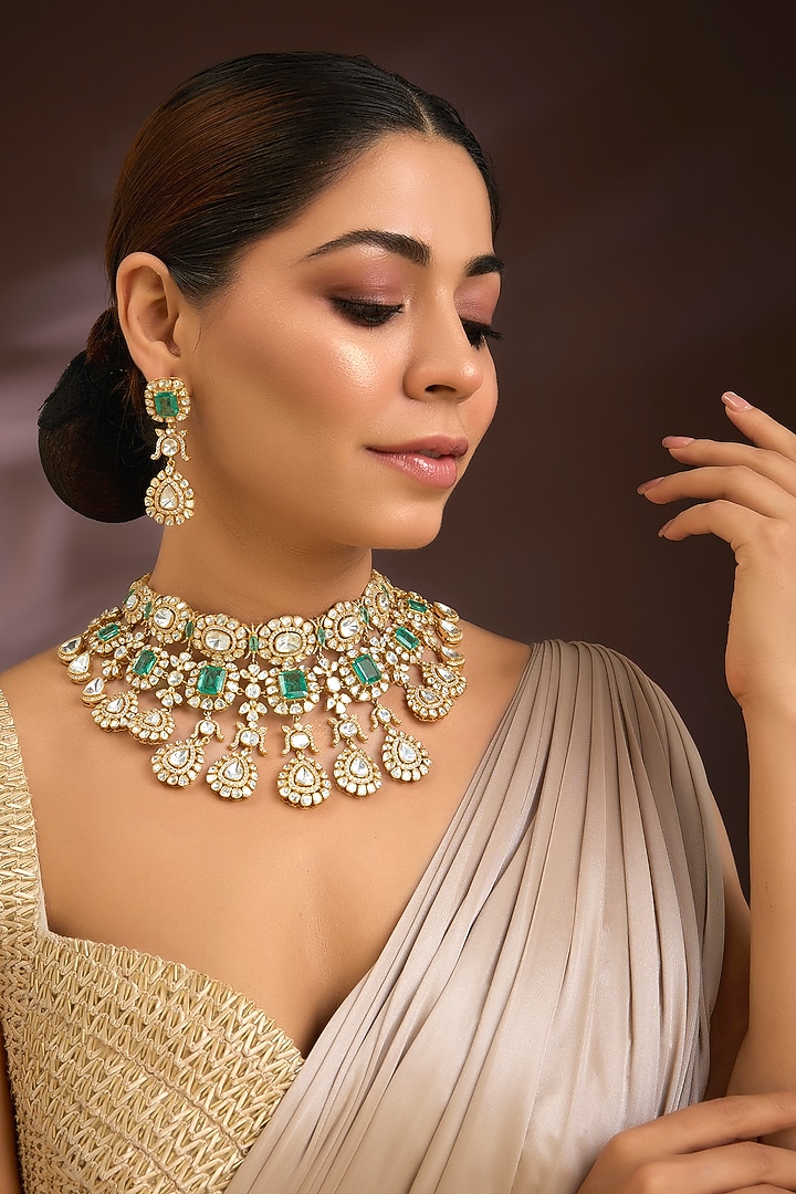 Gold Finish Moissanite Polki & Emerald Green Gemstone Choker Necklace Set In Sterling Silver by Kiara Luxe at Pernia's Pop Up Shop