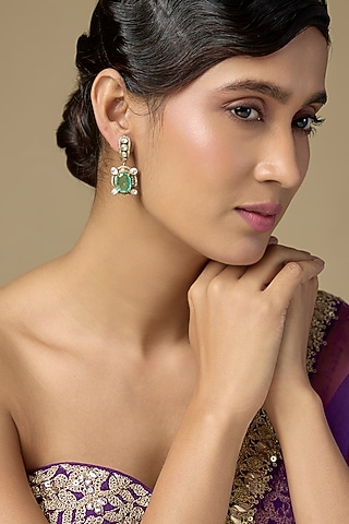Gold Finish Kundan Polki & Oval-Cut Emerald Stone Dangler Earrings In Sterling Silver by Kiara Luxe
