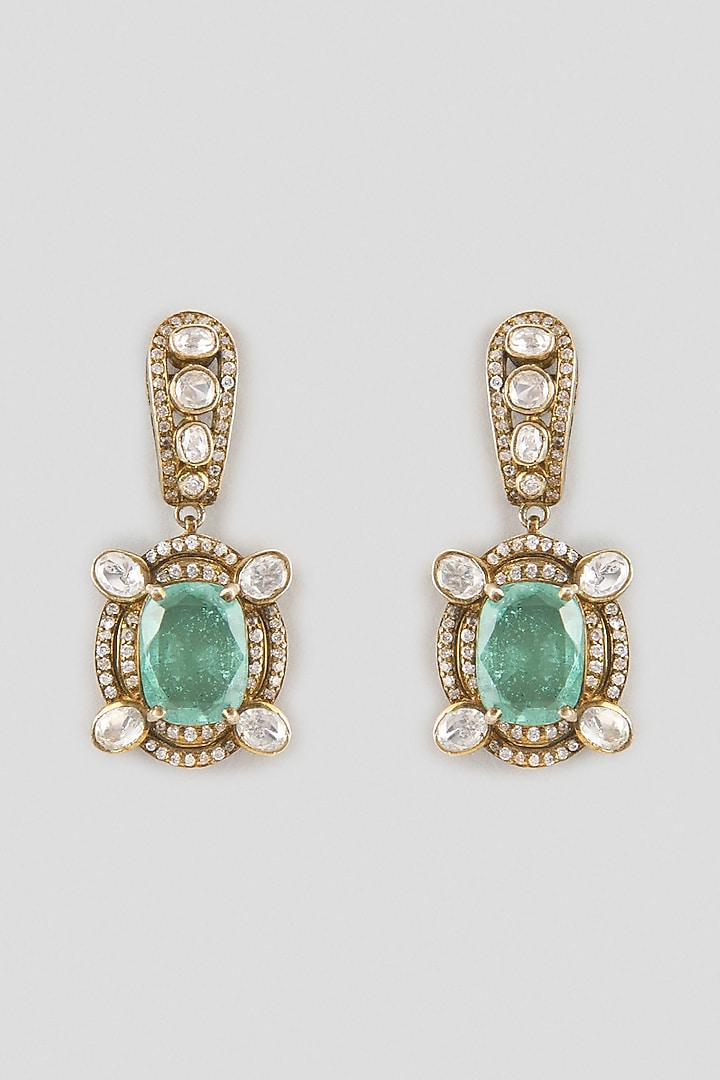 Gold Finish Kundan Polki & Oval-Cut Emerald Stone Dangler Earrings In Sterling Silver by Kiara Luxe at Pernia's Pop Up Shop