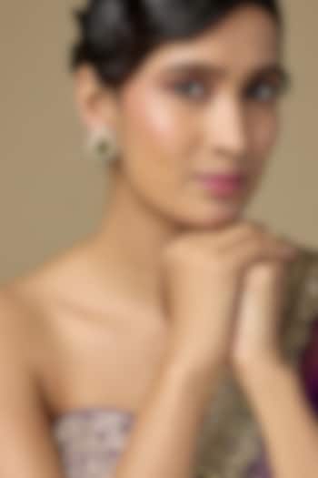 Gold Finish Kundan Polki & Pear-Cut Emerald Drop Stud Earrings In Sterling Silver by Kiara Luxe at Pernia's Pop Up Shop