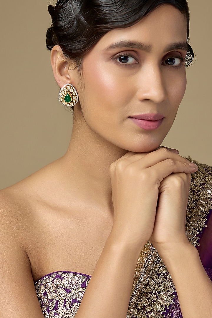 Gold Finish Kundan Polki & Pear-Cut Emerald Drop Stud Earrings In Sterling Silver by Kiara Luxe at Pernia's Pop Up Shop