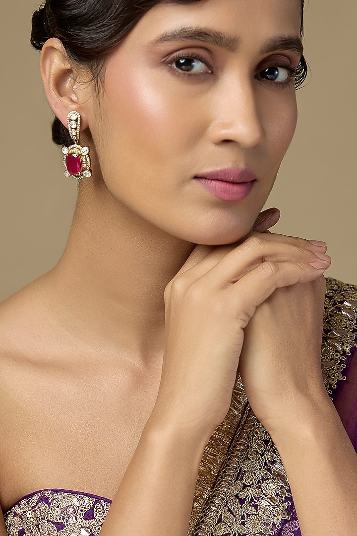 Gold Finish Kundan Polki & Oval-Cut Ruby Stone Dangler Earrings In Sterling Silver by Kiara Luxe at Pernia's Pop Up Shop