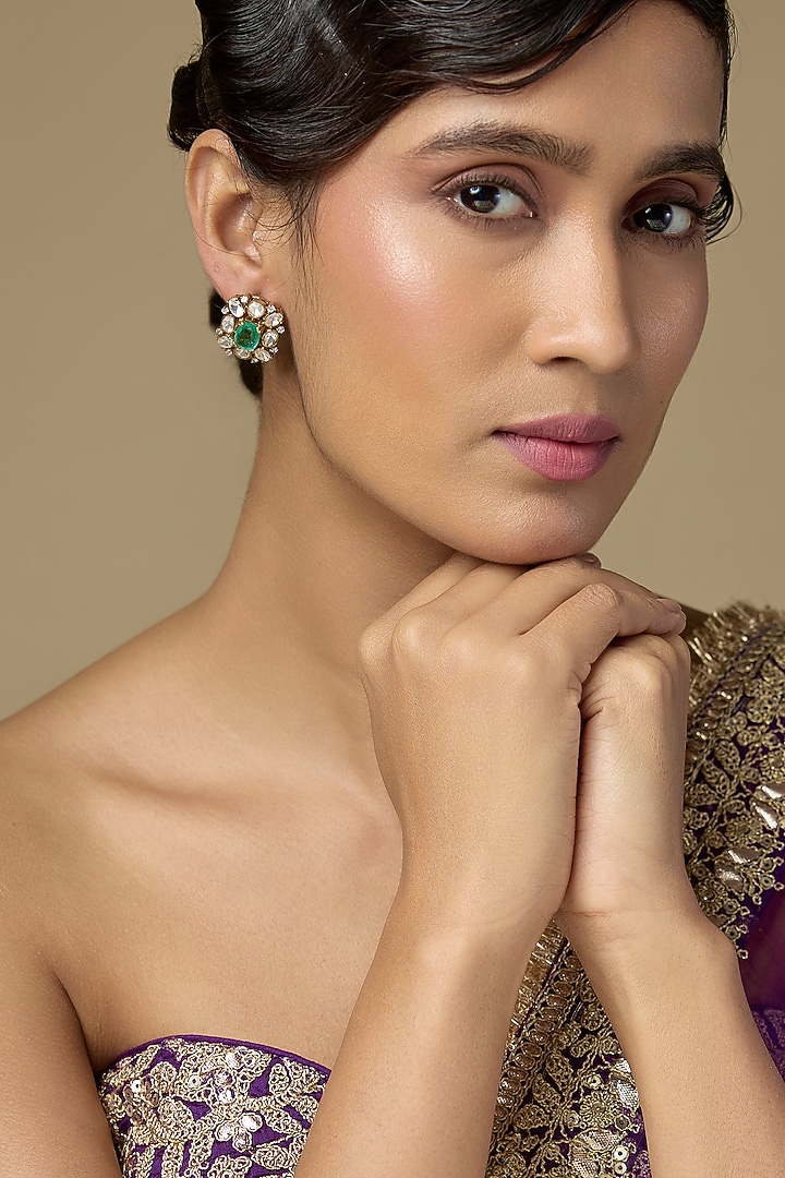 Gold Finish Kundan Polki & Emerald Stone Stud Earrings In Sterling Silver by Kiara Luxe at Pernia's Pop Up Shop