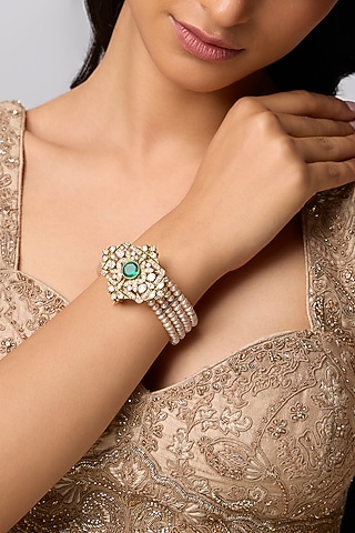 Gold Finish Kundan Polki & Emerald Bracelet In Sterling Silver by Kiara Luxe