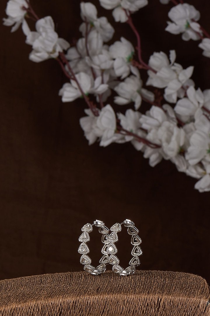 White Finish Moissanite Hoop Earrings In Sterling Silver by Kiara Luxe at Pernia's Pop Up Shop