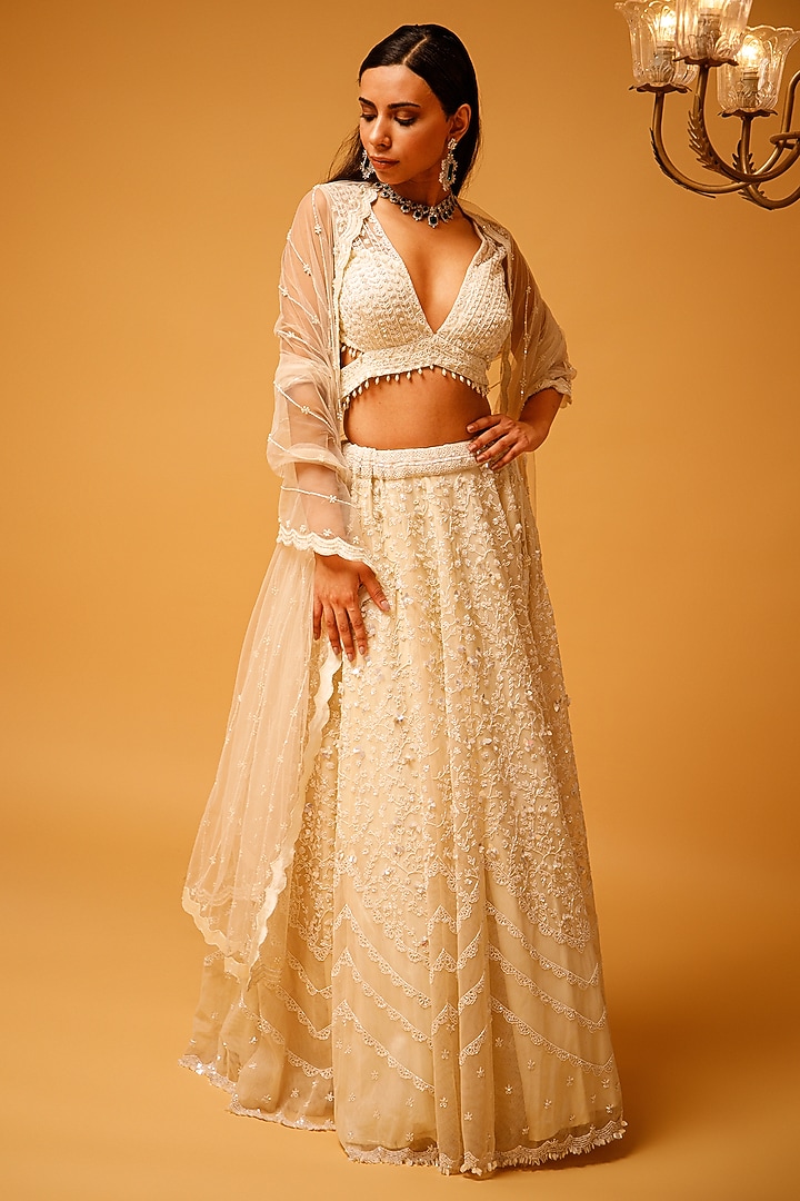 Ivory Tulle Embroidered Bridal Lehenga Set by KANJ By Priyanka Sakhuja at Pernia's Pop Up Shop