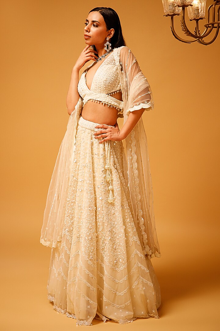 Ivory Tulle Embroidered Bridal Lehenga Set by KANJ By Priyanka Sakhuja at Pernia's Pop Up Shop