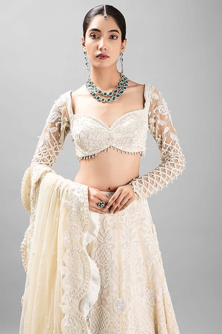 Ivory Satin Embroidered Bridal Lehenga Set by KANJ By Priyanka Sakhuja at Pernia's Pop Up Shop