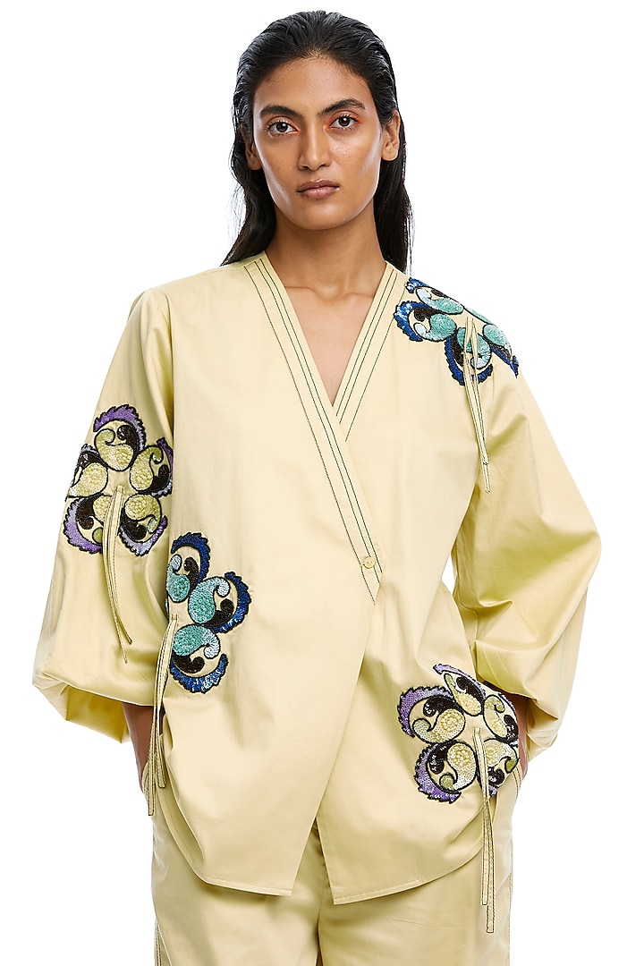 Light Yellow Cotton Hand Embellished Wrap Top by Kanika Goyal at Pernia's Pop Up Shop