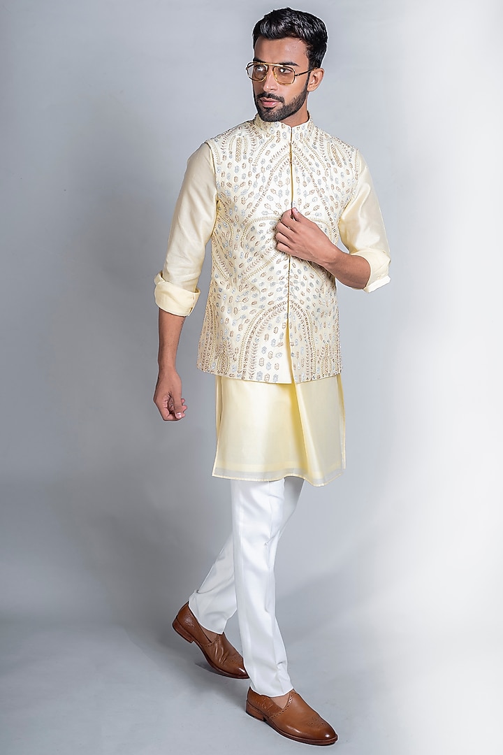 Lemon Yellow Chanderi Silk Kurta Set With Bundi Jacket by Kanishk Mehta Designs