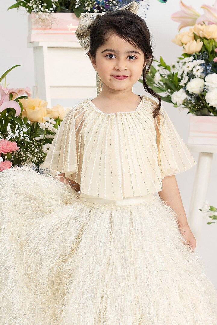 Ivory Net Pearl Hand Work Flared Lehenga Set For Girls by Kirti Agarwal Pret n Couture at Pernia's Pop Up Shop