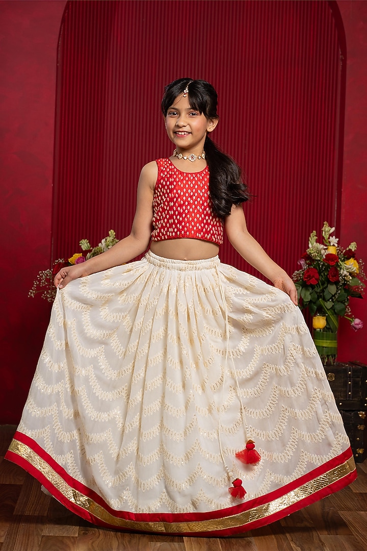 Ivory & red Pure Raw Silk Floral Embroidered Lehenga Set For Girls by Kirti Agarwal Pret n Couture at Pernia's Pop Up Shop
