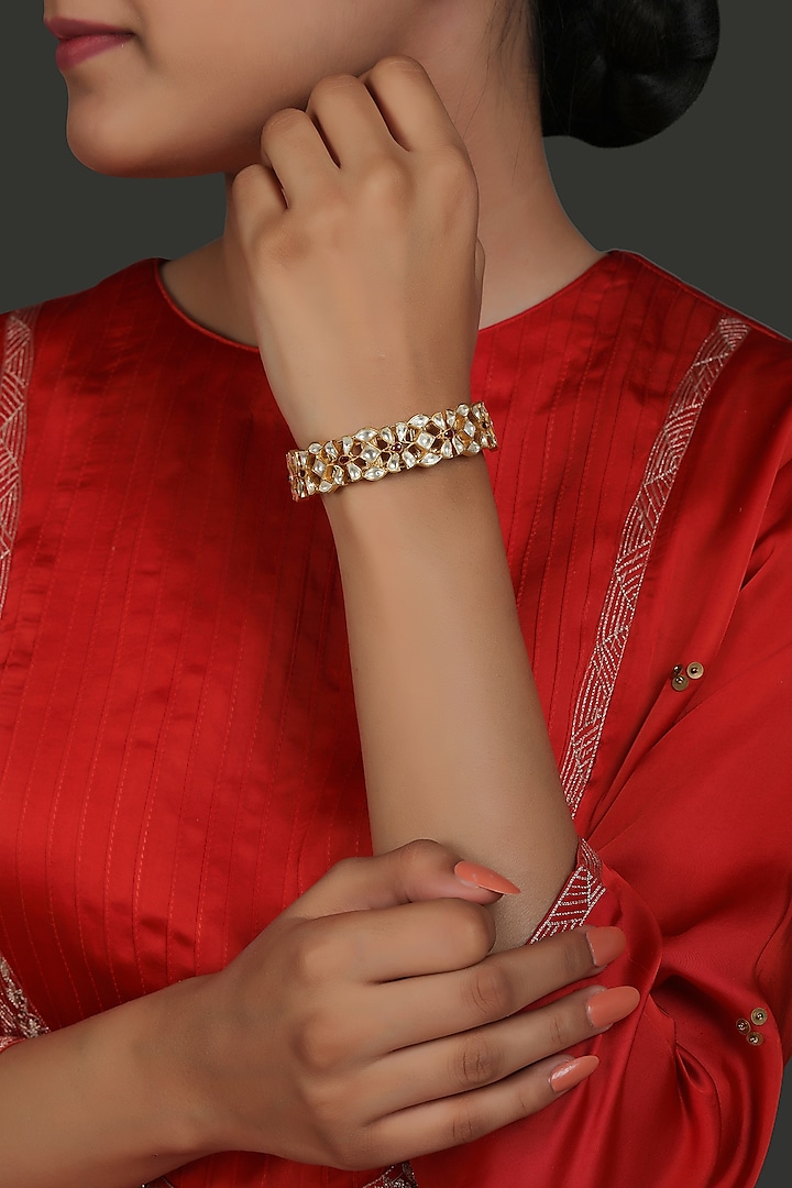Gold Finish Kundan Polki Poronchi Bracelet In Sterling Silver by Kaari