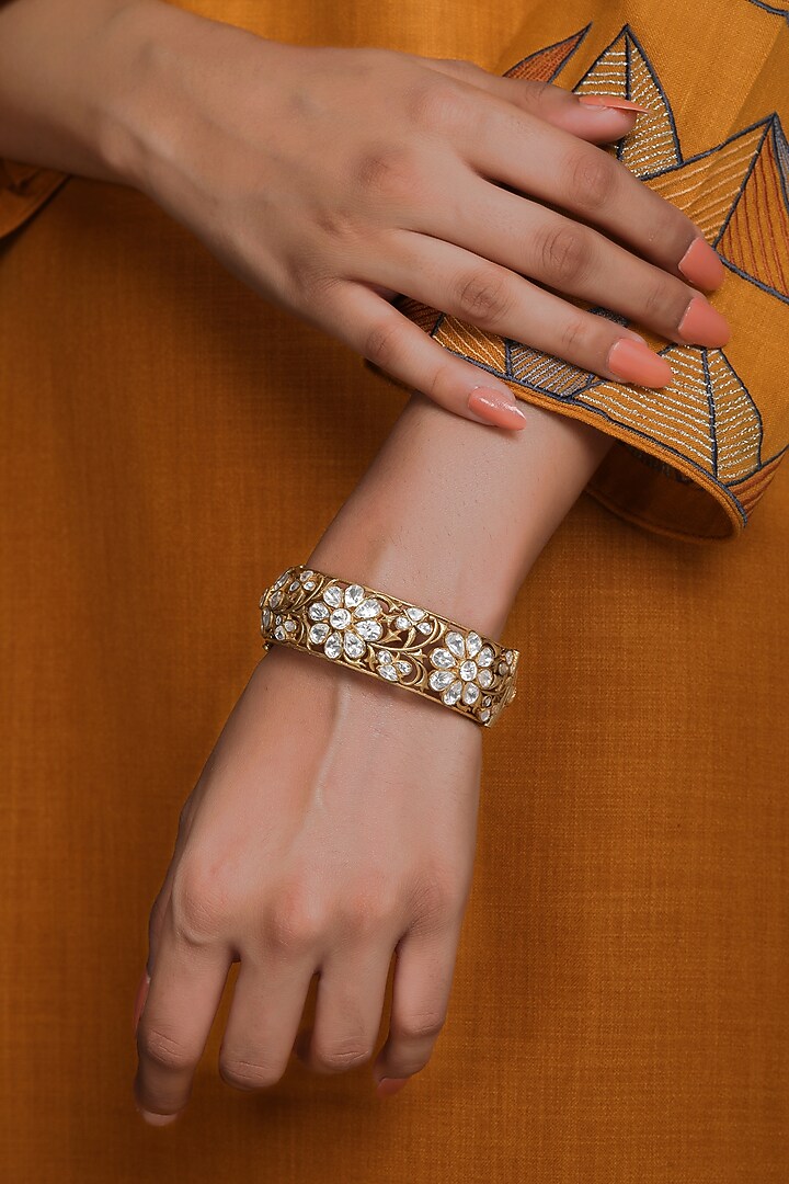 Gold Finish Kundan Polki Cutwork Jali Kada In Sterling Silver by Kaari at Pernia's Pop Up Shop