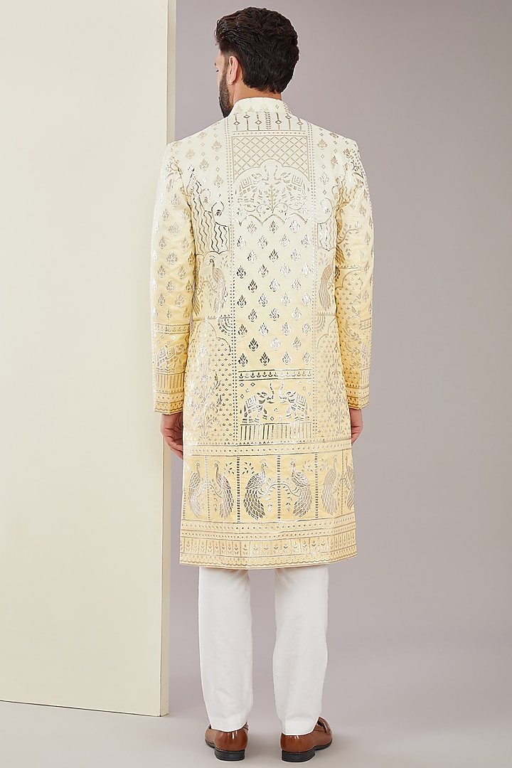 Yellow Chanderi Silk Floral Applique Embroidered Wedding Sherwani by Kasbah Clothing at Pernia's Pop Up Shop