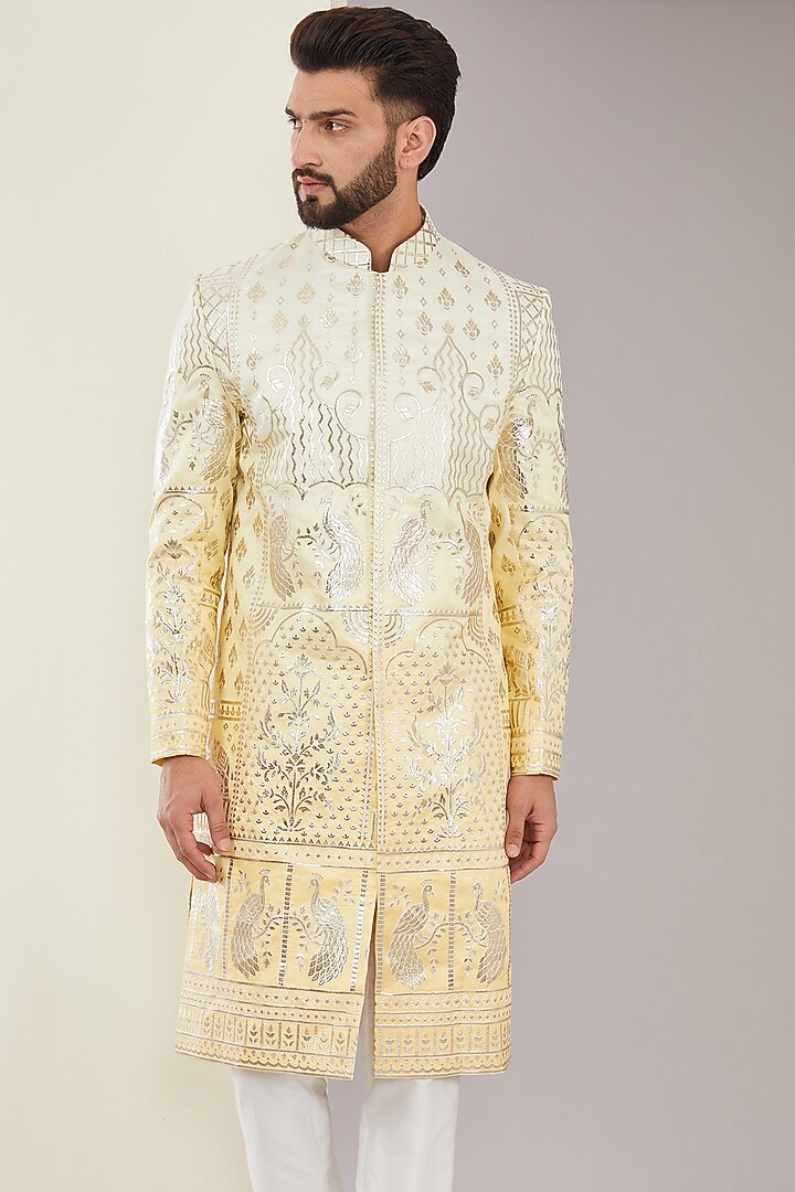 Yellow Chanderi Silk Floral Applique Embroidered Wedding Sherwani by Kasbah Clothing at Pernia's Pop Up Shop