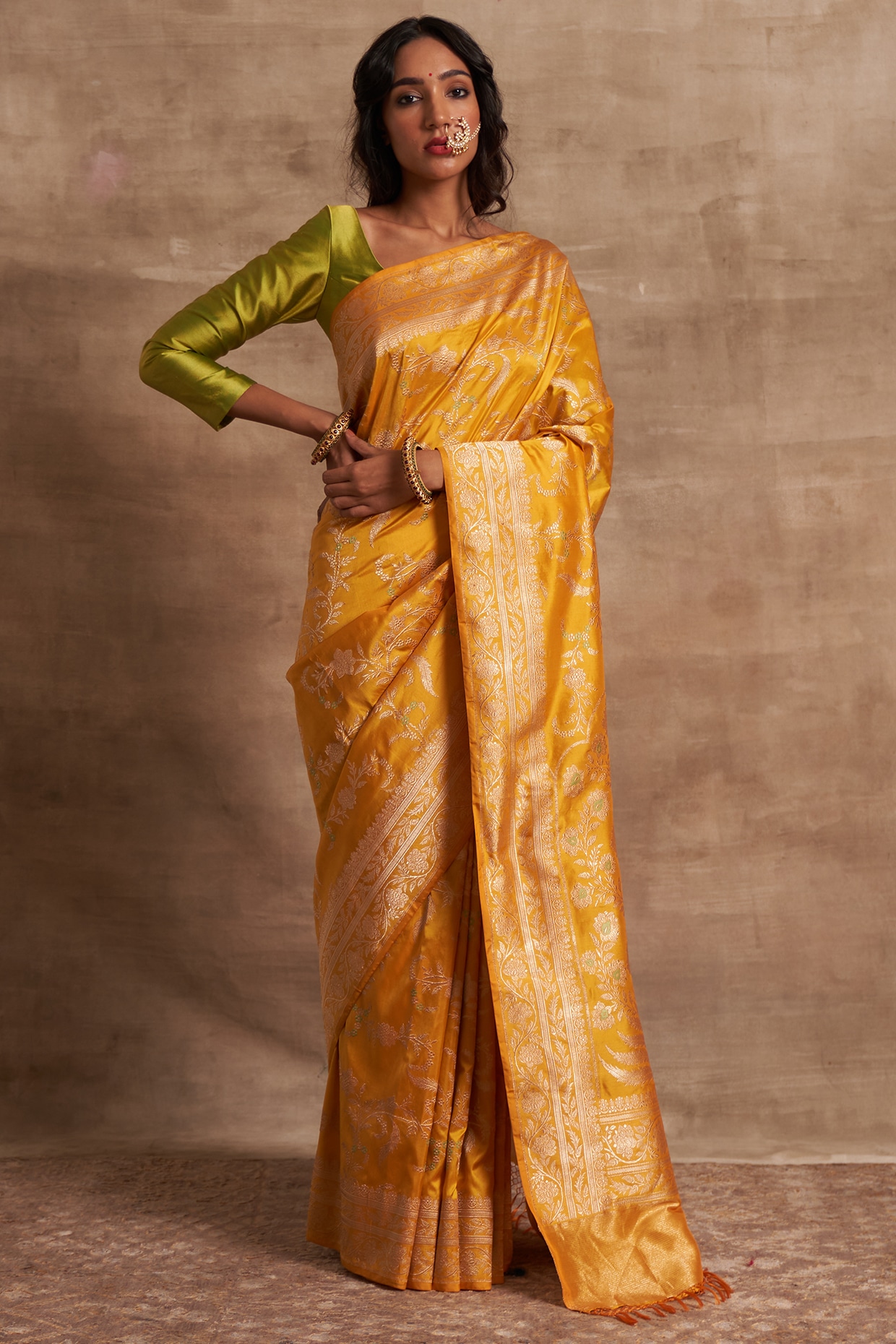 Yellow color banarasi silk saree with golden zari weaving work