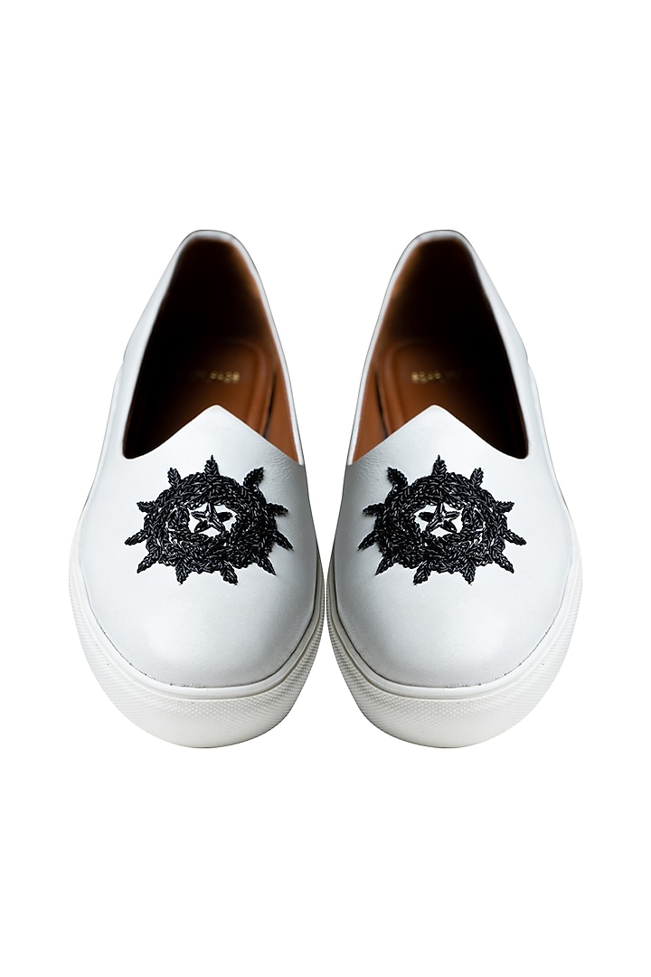 White Handcrafted Juttis With Black Embroidery by Kavith