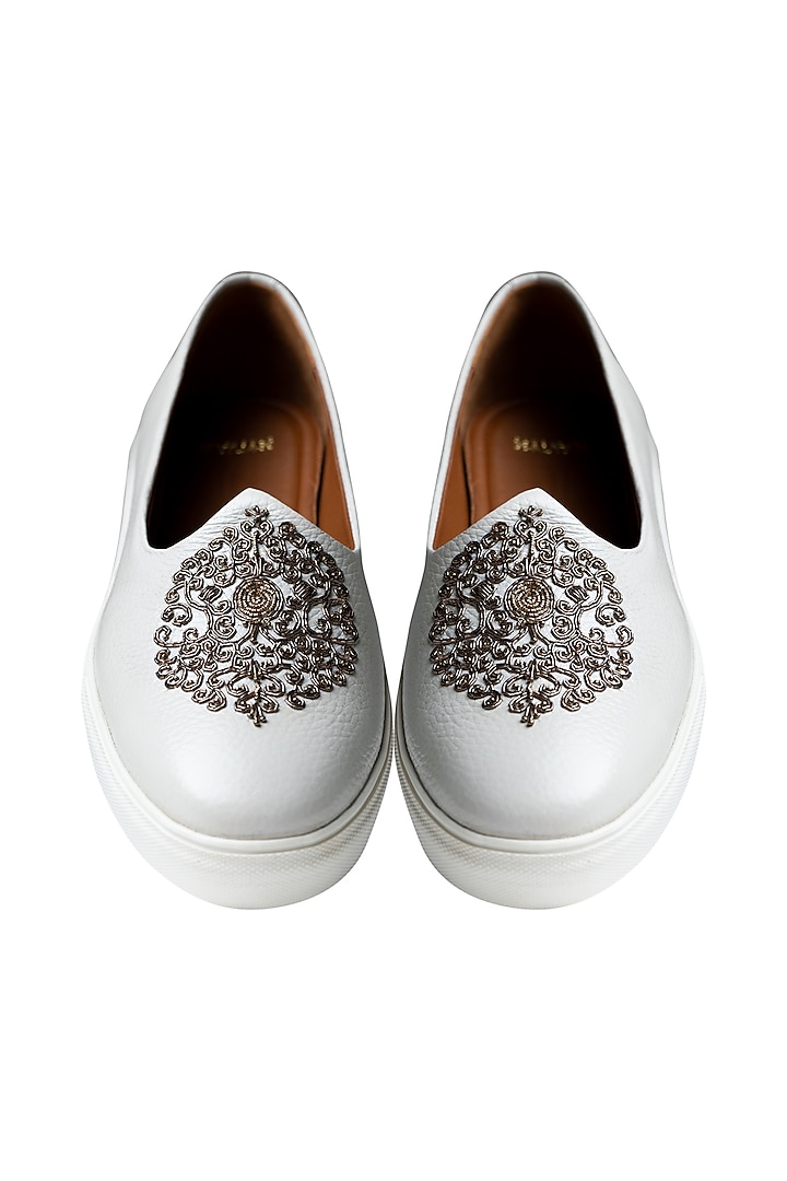 White Handcrafted Juttis With Bronze Embroidery by Kavith