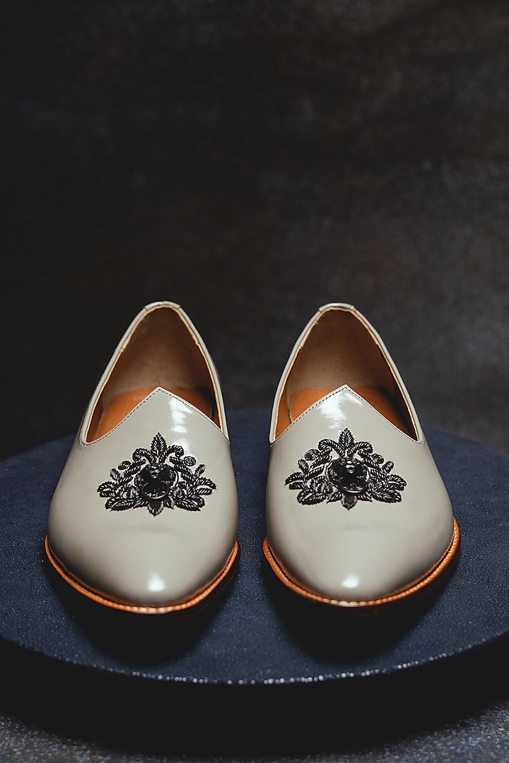 White Leather Embroidered Juttis by Kavith