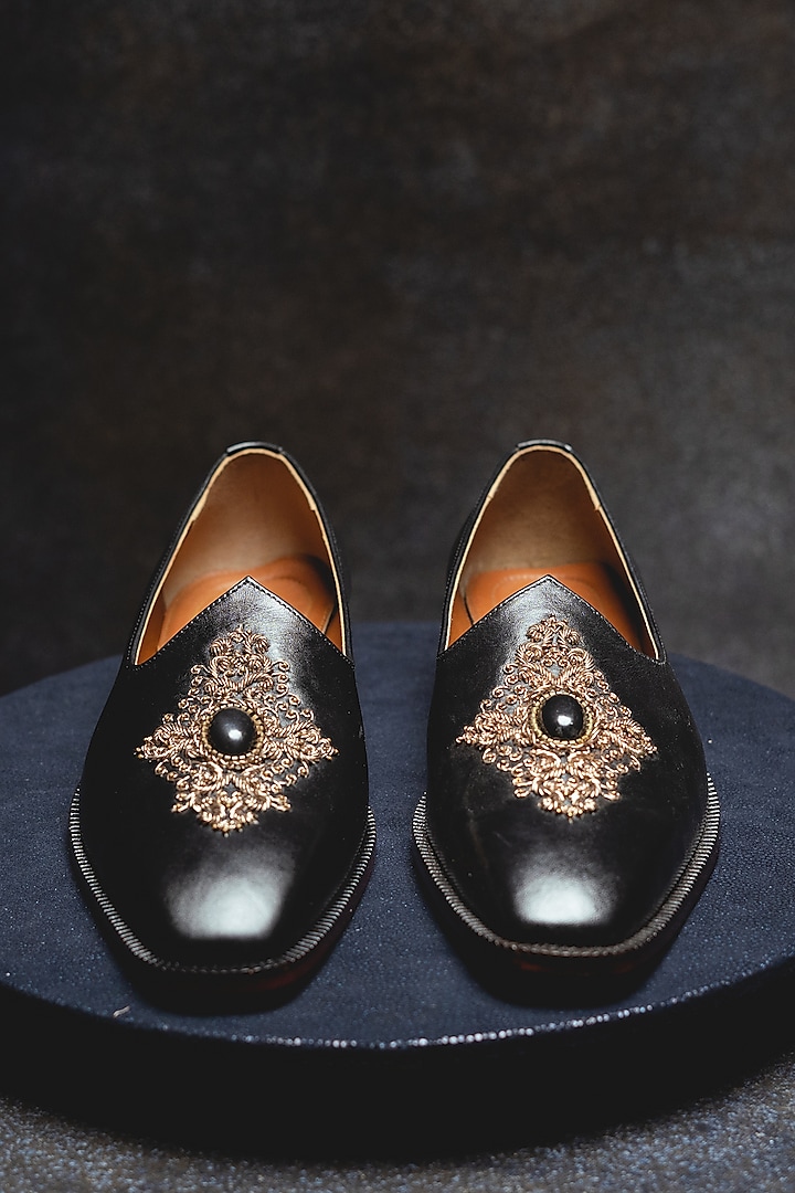 Black Embroidered Juttis In Leather by Kavith