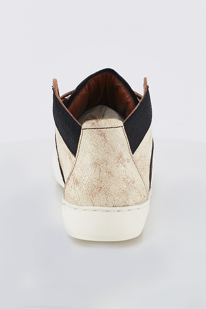 Off White & Black Calf Hair Sneakers by Kavith at Pernia's Pop Up Shop