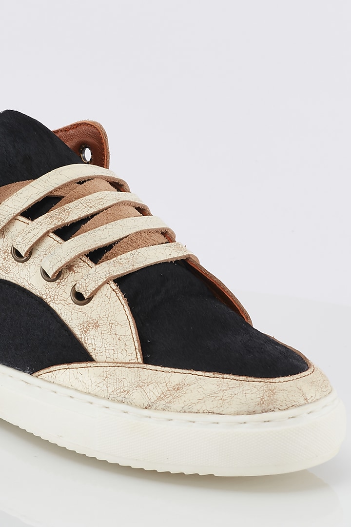 Off White & Black Calf Hair Sneakers by Kavith at Pernia's Pop Up Shop