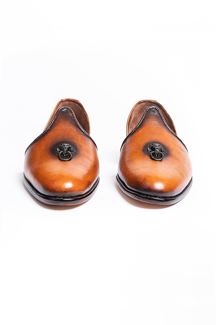 Brown Leather Juttis With Lion Ornamentation by Kavith at Pernia's Pop Up Shop