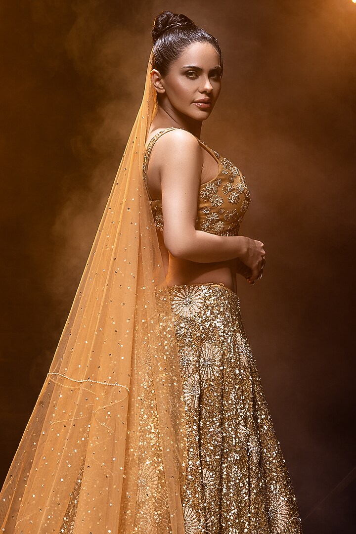 Golden Net Hand Embroidered Bridal Lehenga Set by Kavita Arora at Pernia's Pop Up Shop