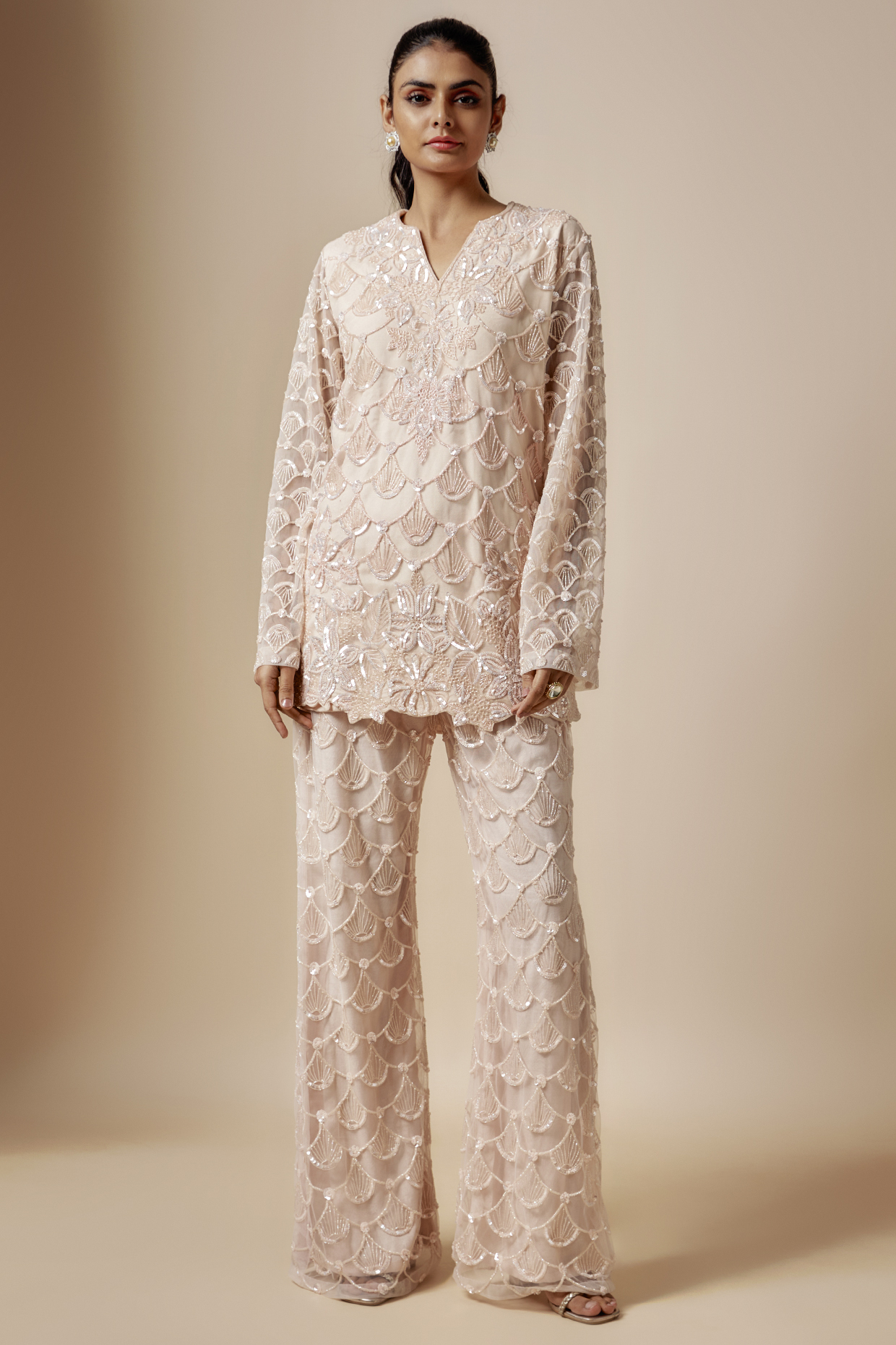 Peach Net Cutdana Hand Embellished Kurta Set by Kashmiraa at Pernia's Pop Up Shop