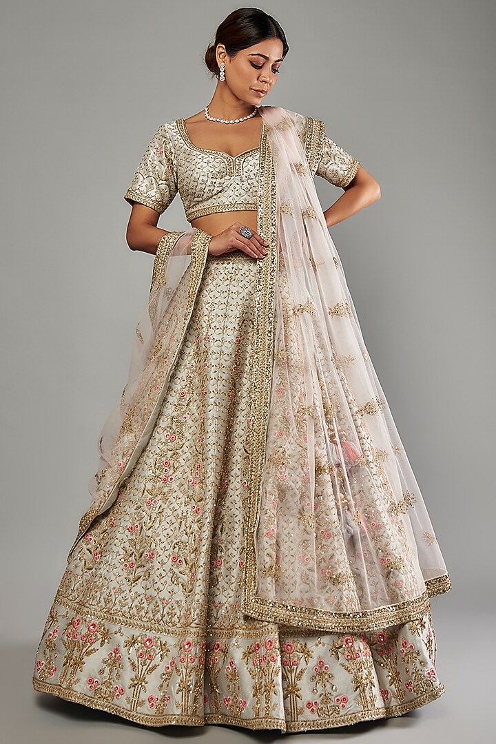 Ivory Raw Silk Embellished Wedding Lehenga Set by Kalighata at Pernia's Pop Up Shop