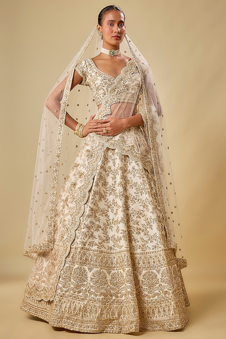 Ivory Raw Silk Hand & Machine Embroidered Bridal Lehenga Set by Kalighata at Pernia's Pop Up Shop