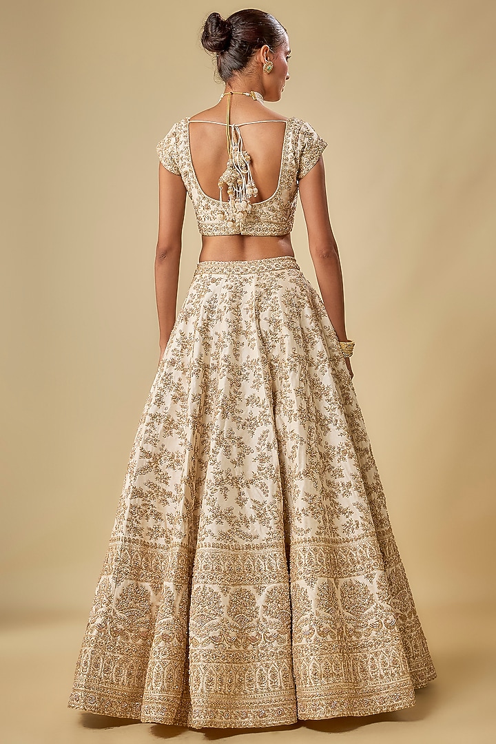 Ivory Raw Silk Hand & Machine Embroidered Bridal Lehenga Set by Kalighata at Pernia's Pop Up Shop