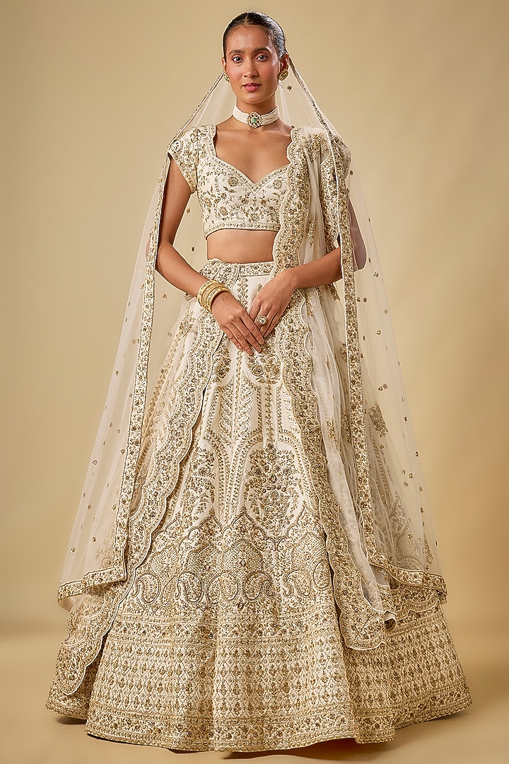 Ivory Raw Silk Hand & Machine Embroidered Bridal Lehenga Set by Kalighata at Pernia's Pop Up Shop
