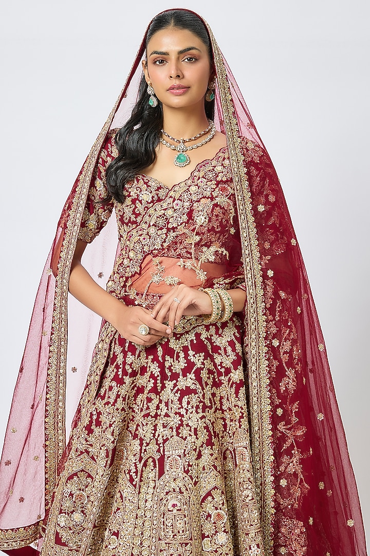 Maroon Raw Silk Cutdana Hand & Machine Embroidered Bridal Lehenga Set by Kalighata at Pernia's Pop Up Shop