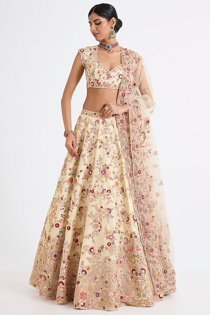 Ivory Raw Silk Zari Hand & Machine Embroidered Bridal Lehenga Set by Kalighata at Pernia's Pop Up Shop