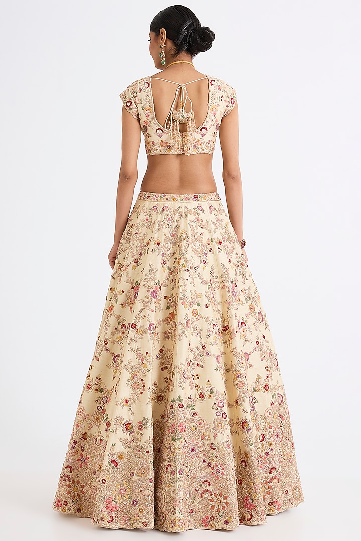 Ivory Raw Silk Zari Hand & Machine Embroidered Bridal Lehenga Set by Kalighata at Pernia's Pop Up Shop