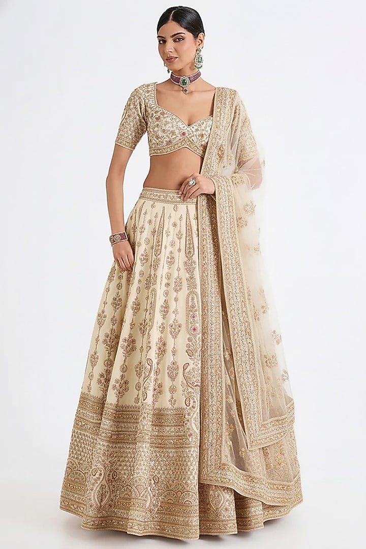 Ivory Raw Silk Hand & Machine Embroidered Bridal Lehenga Set by Kalighata at Pernia's Pop Up Shop