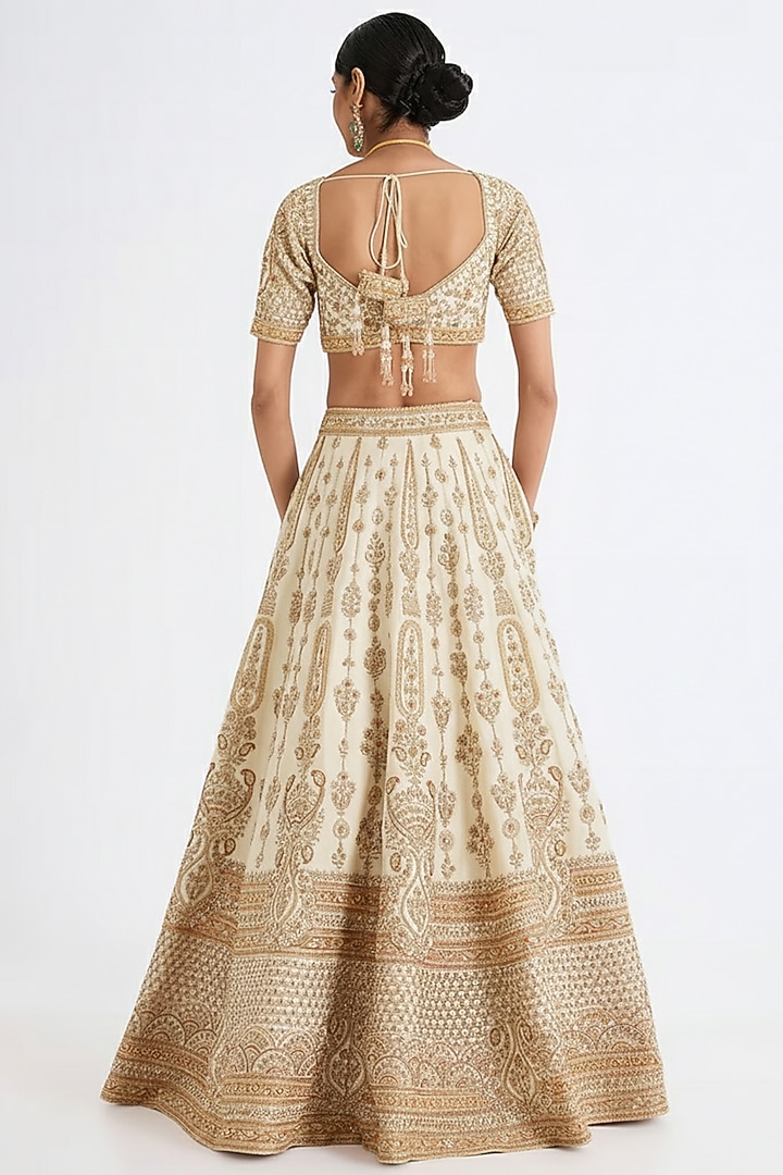 Ivory Raw Silk Hand & Machine Embroidered Bridal Lehenga Set by Kalighata at Pernia's Pop Up Shop