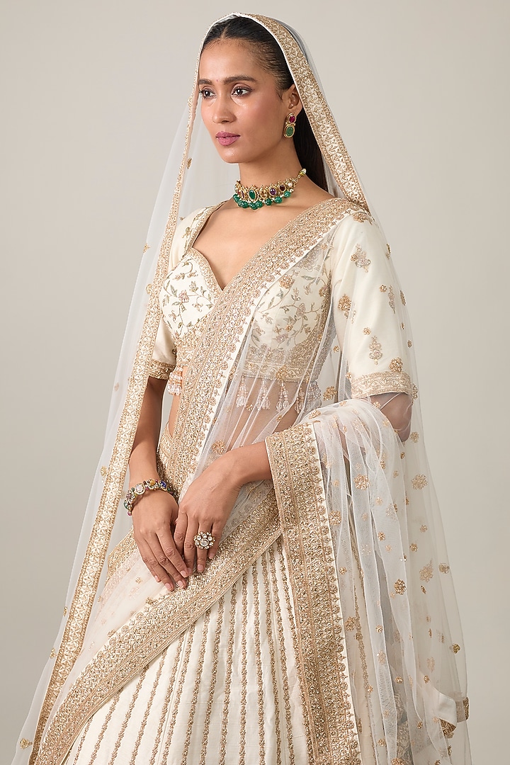 Ivory Raw Silk Bridal Lehenga Set by Kalighata at Pernia's Pop Up Shop