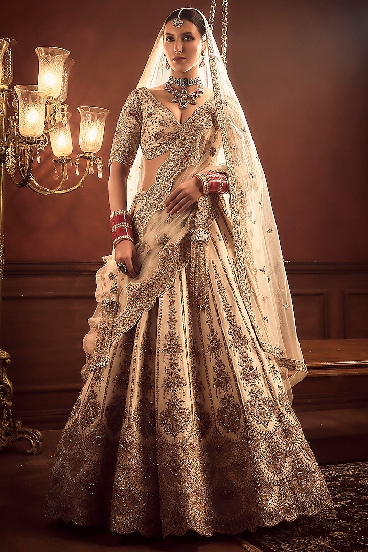 Ivory Raw Silk Hand & Machine Embroidered Bridal Lehenga Set by Kalighata at Pernia's Pop Up Shop