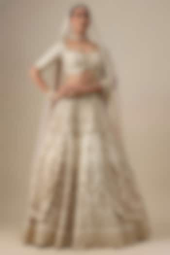 Ivory Raw Silk Hand & Machine Embroidered Bridal Lehenga Set by Kalighata at Pernia's Pop Up Shop