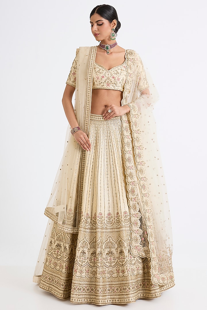 Ivory Raw Silk Zari Hand & Machine Embroidered Bridal Lehenga Set by Kalighata at Pernia's Pop Up Shop