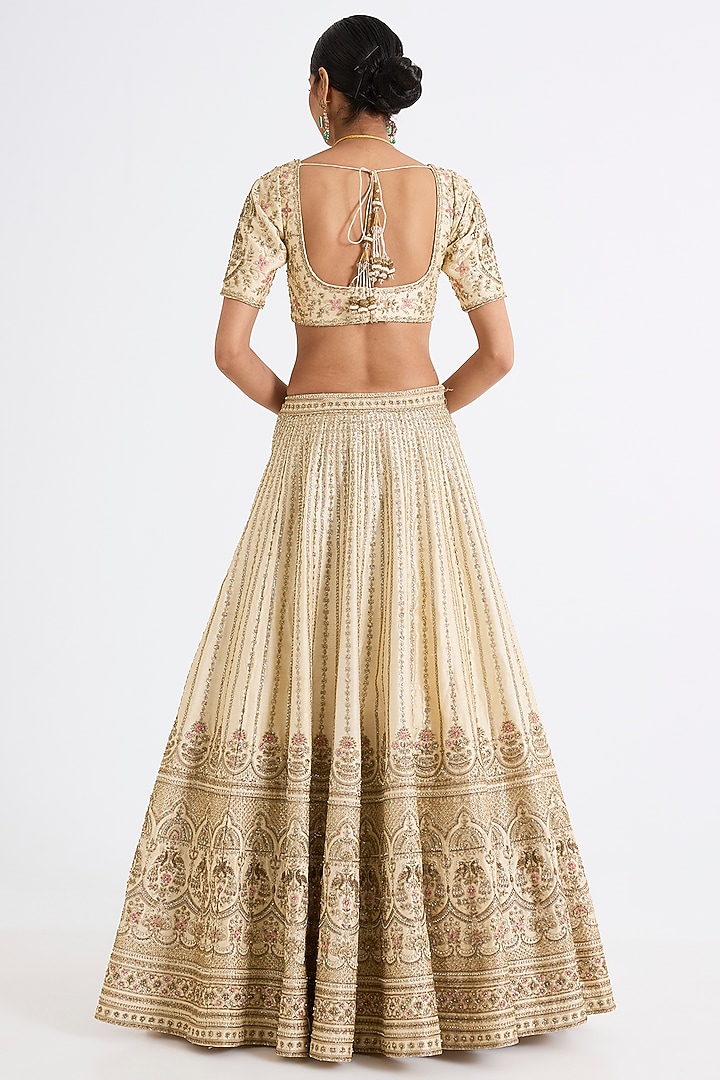 Ivory Raw Silk Zari Hand & Machine Embroidered Bridal Lehenga Set by Kalighata at Pernia's Pop Up Shop