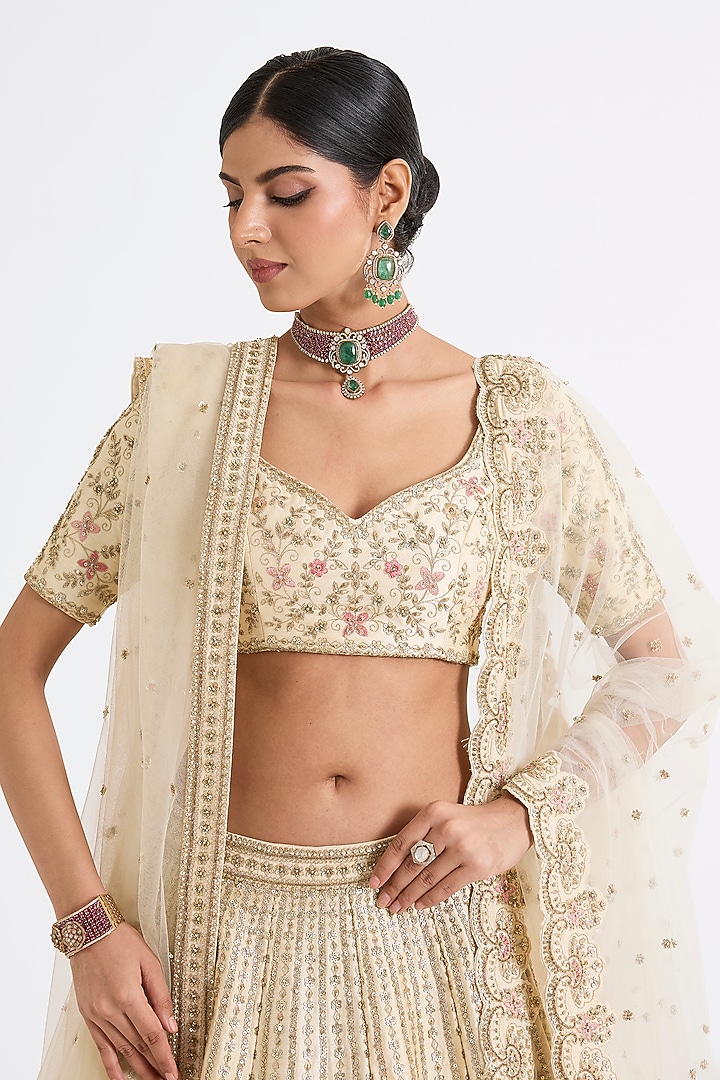 Ivory Raw Silk Zari Hand & Machine Embroidered Bridal Lehenga Set by Kalighata at Pernia's Pop Up Shop
