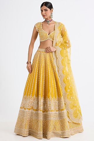Yellow Raw Silk Zari Hand & Machine Embroidered Lehenga Set by Kalighata