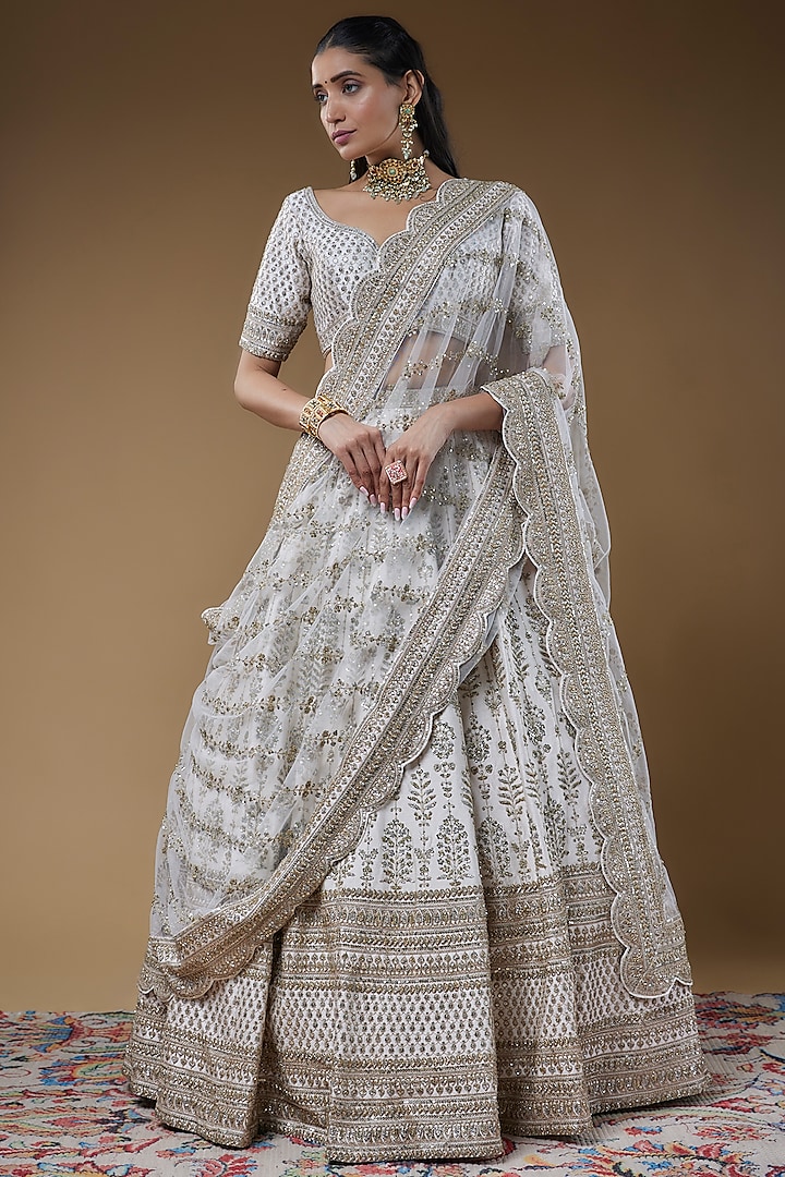 Ivory Raw Silk Embroidered Lehenga Set by Kalighata